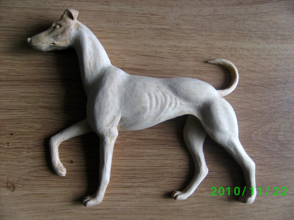 A dog centrepiece carved in wood - dog centrepiece