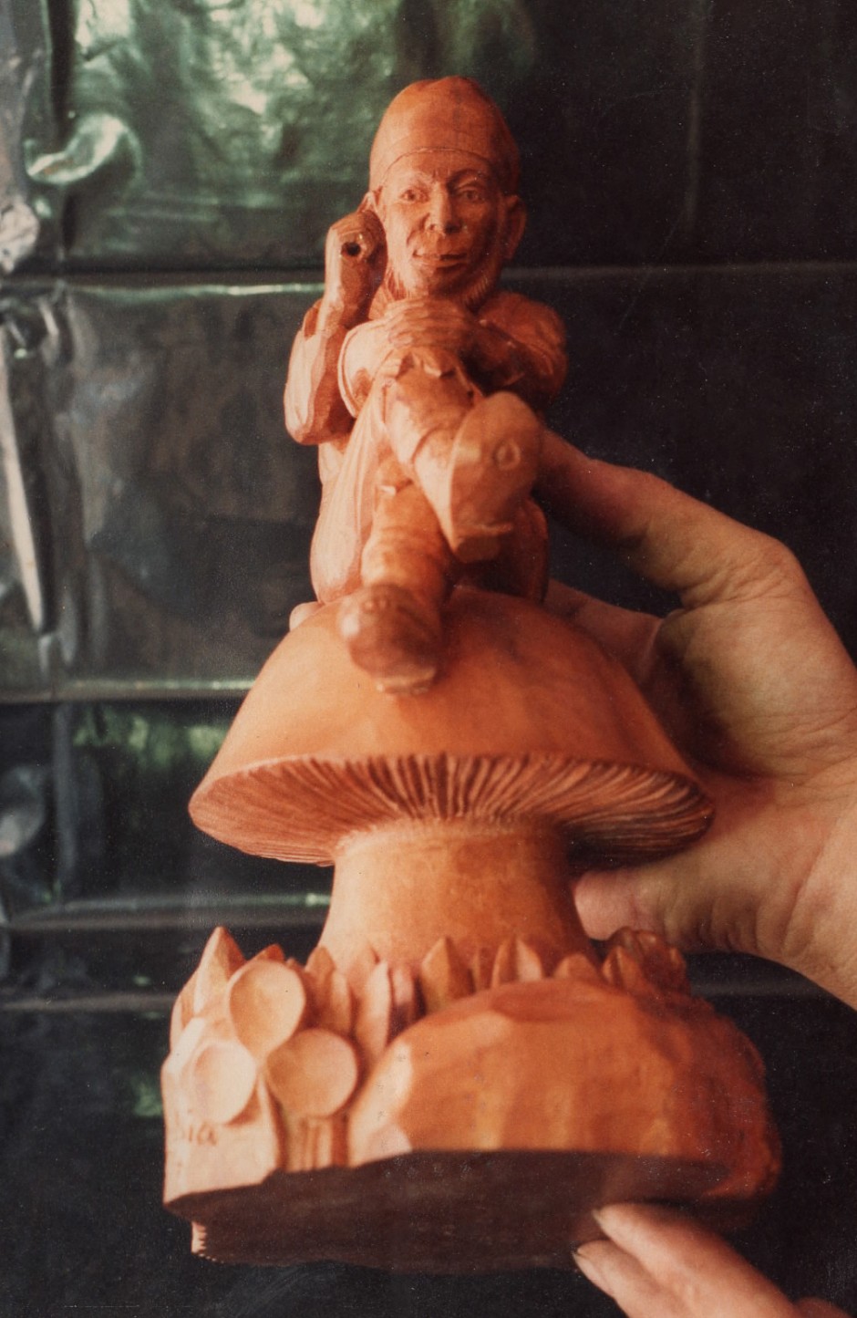 Front view of the finished carving with hands for scale - gone hand carved wood carver