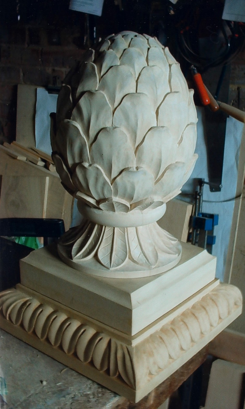 The finished carving on its base - pineapple, base, ornament